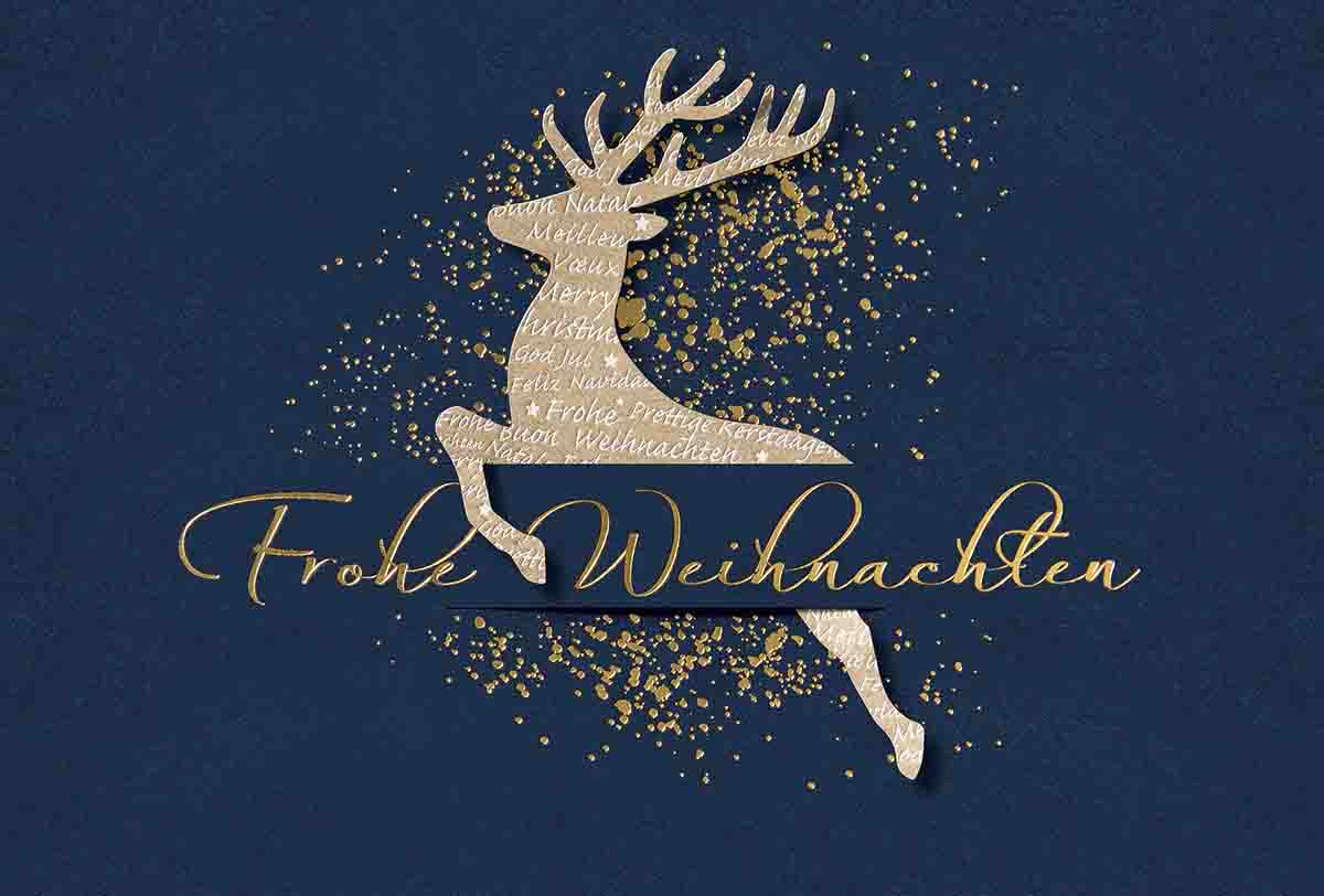 Festliche Weihnachtskarte mit eingestecktem, springenden Hirsch und Weihnachtsgruß