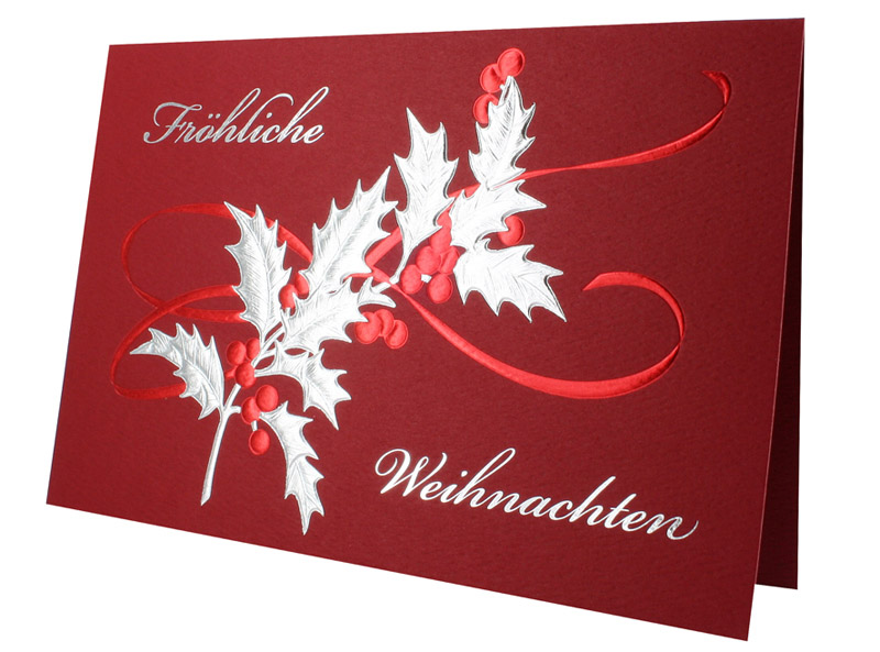 Rote Weihnachtskarte mit Silber- und Rotfolienprägung von Gruß und Stechpalme