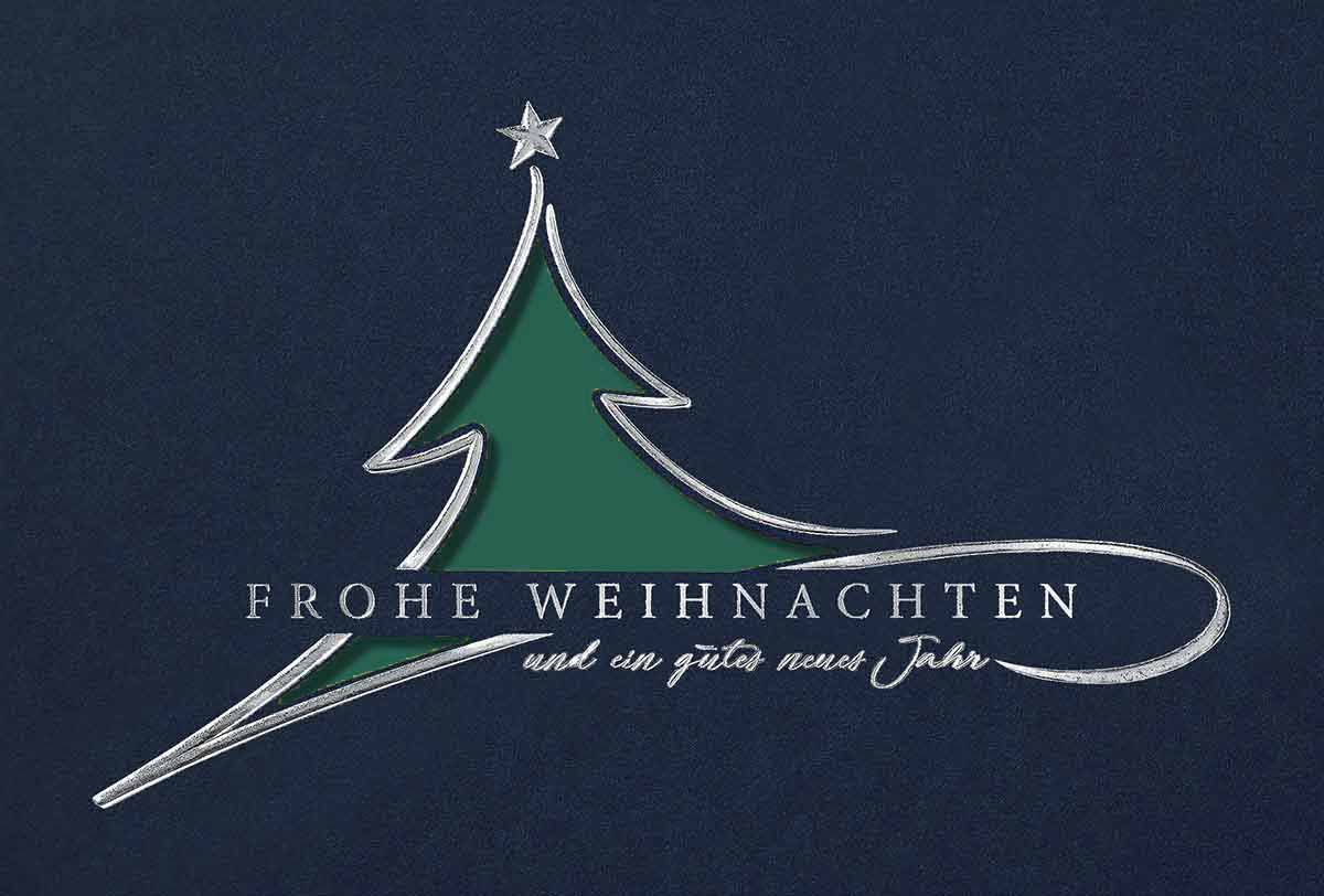 Stanz-Weihnachtskarte in blau mit dunkelgrünem Einleger und edler Silberfolienprägung