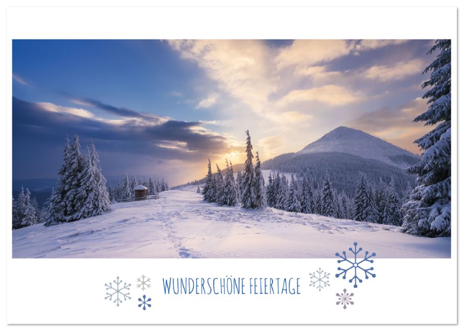 Naturverbundene Weihnachtskarte mit beeindruckender, winterlicher Berglandschaft und dem Gruß "Wunderschöne Feiertage"