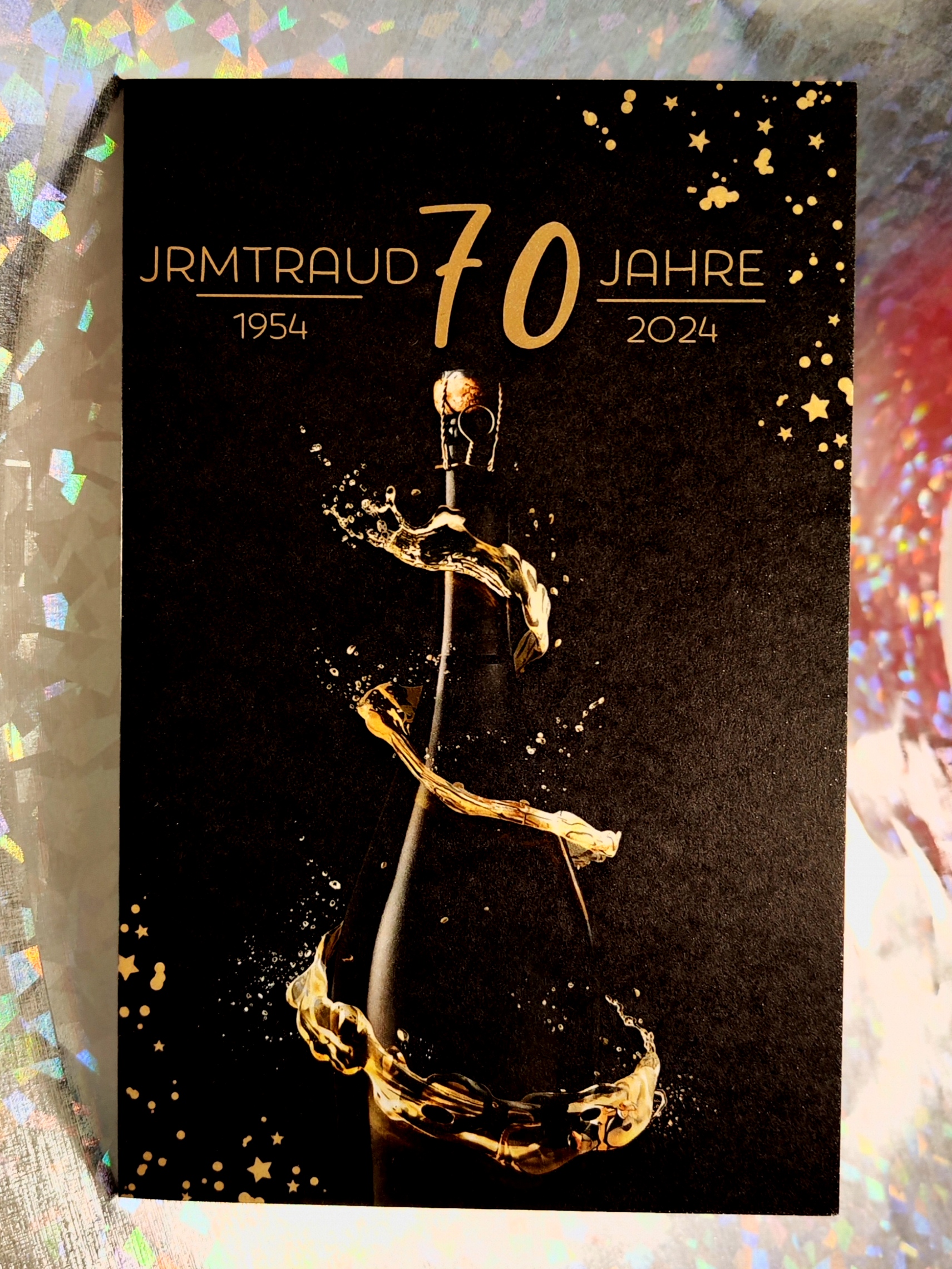 Einladungskarte zum 70 Geburtstag in schwarz/gold mit Champagnerflasche