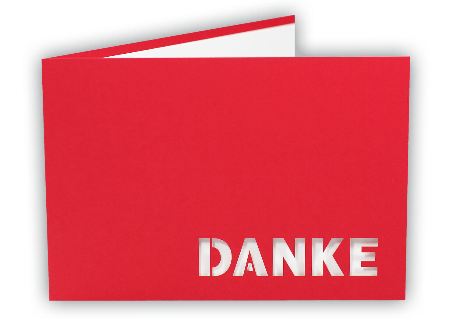 Rote Danksagungskarte querdoppelt mit ausgestanztem Schriftzug "DANKE" und weißem Einlegeblatt