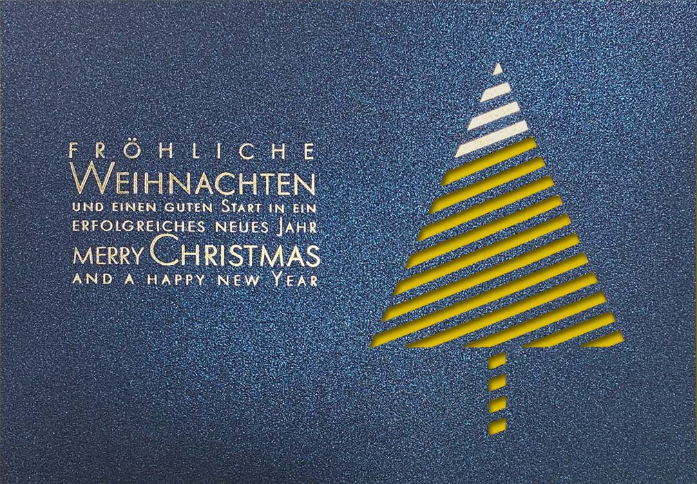 Blaue Weihnachtskarte mit Goldfolienprägung und Stanzung, mehrsprachig, Einleger gelb