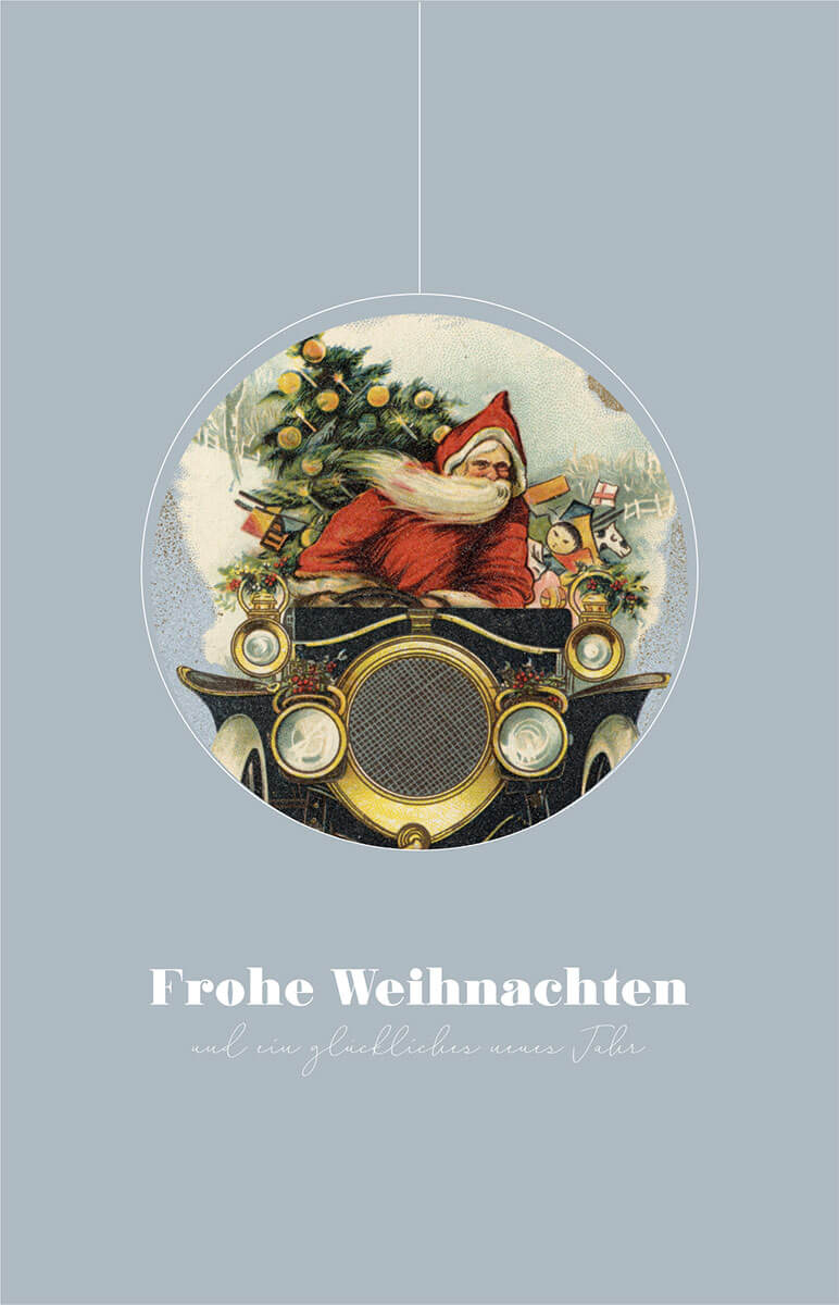 Lustige Weihnachtskarte mit Weihnachtsmann und Christbaum auf der Fahrt im Oldtimer