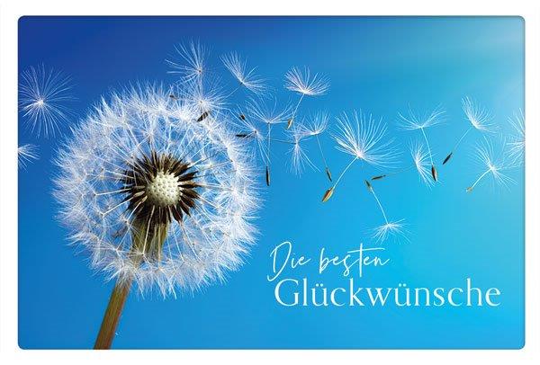 Blaue Glückwunschkarte mit Pusteblume, fliegenden Samen und Glückwunsch in weiß