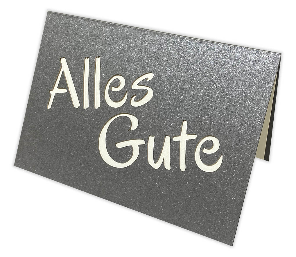 Anthrazitgraue Glückwunsch-Grußkarte mit Schriftzug-Ausstanzung "Alles Gute" und perlmuttfarbenes Einlegeblatt 