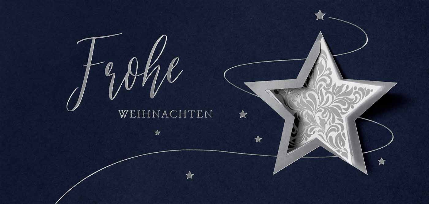 Dunkelblaue Weihnachtskarte mit silbernen Weihnachtsgrüßen, Sternstanzung und Ornamentstern