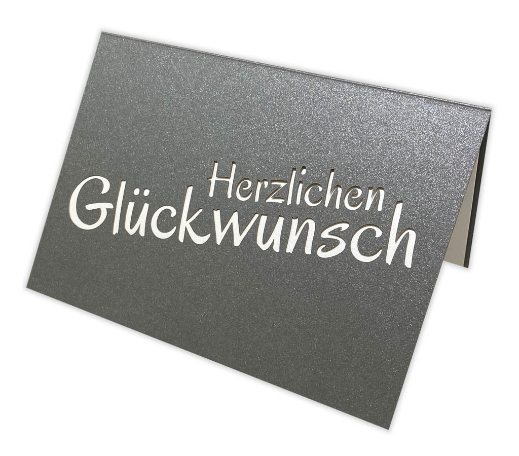 Anthrazitgraue Glückwunschkarte mit Ausstanzung "Herzlichen Glückwunsch" und Einlegeblatt 