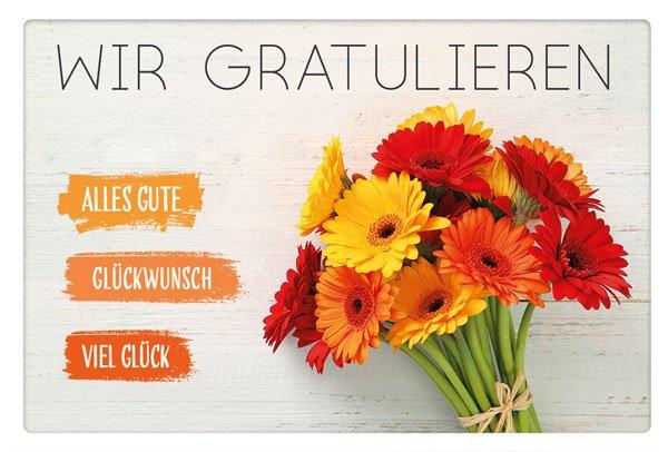 Blumige Glückwunschkarte mit "Wir gratulieren" und einem Strauß bunter Gerberas