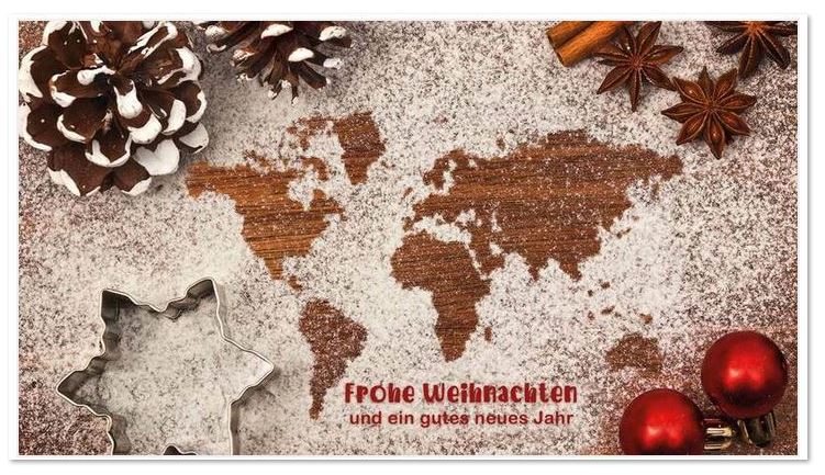 Weihnachtskarte im Kleinformat mit Sternausstecher und Weltkarte im Mehl sowie Weihnachtsgruß