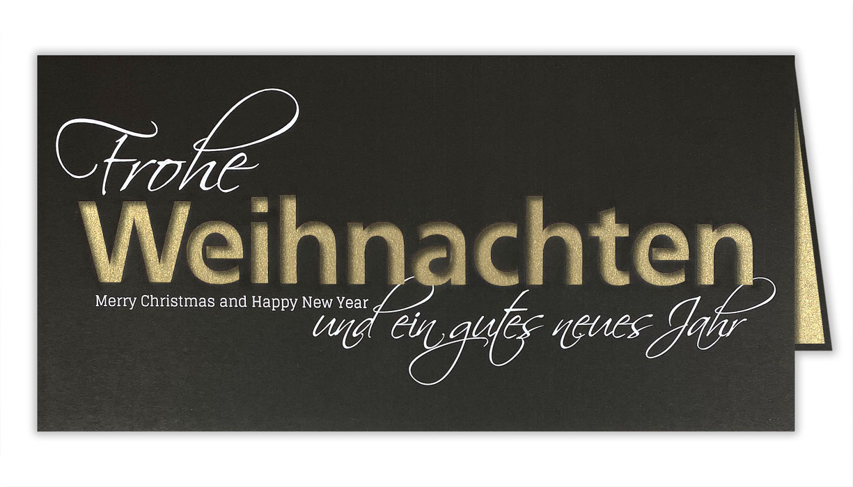 Schwarze Weihnachtskarte mit weißem Schriftzug und goldenem Einlegeblatt