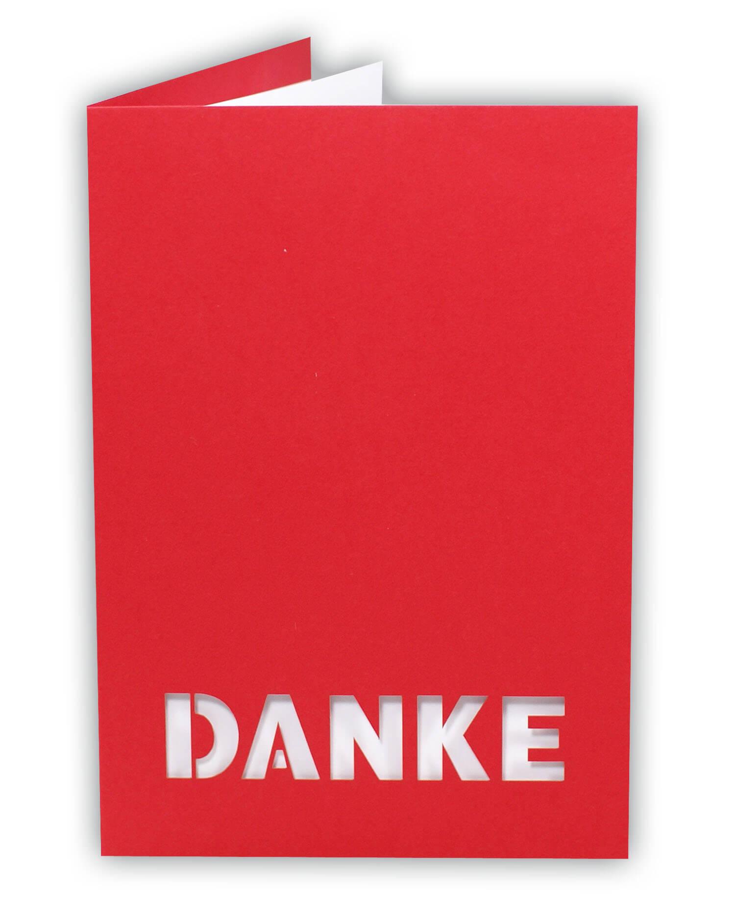 Rote Danksagungskarte mit ausgestanztem Schriftzug "DANKE" und weißem Einlegeblatt