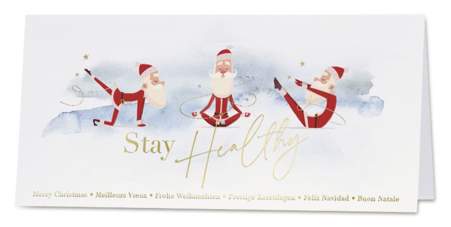 Originelle Weihnachtskarte "Stay Healty" mit internationalen Grüßen und turnenden Weihnachtsmännern