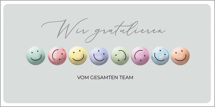 Lustige Firmenglückwunschkarte mit fühlbaren Smileys und "Wir gratulieren" - Vom gesamten Team