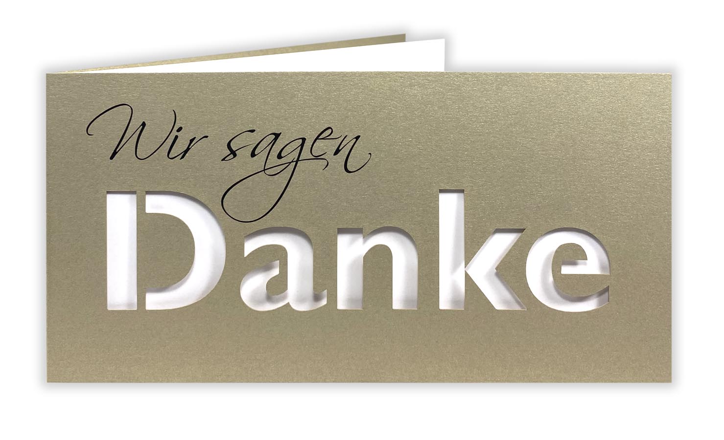 Goldene Dankkarte DIN lang mit gedrucktem "Wir sagen", ausgestanztem Schriftzug "DANKE" und passenden Einlegeblatt