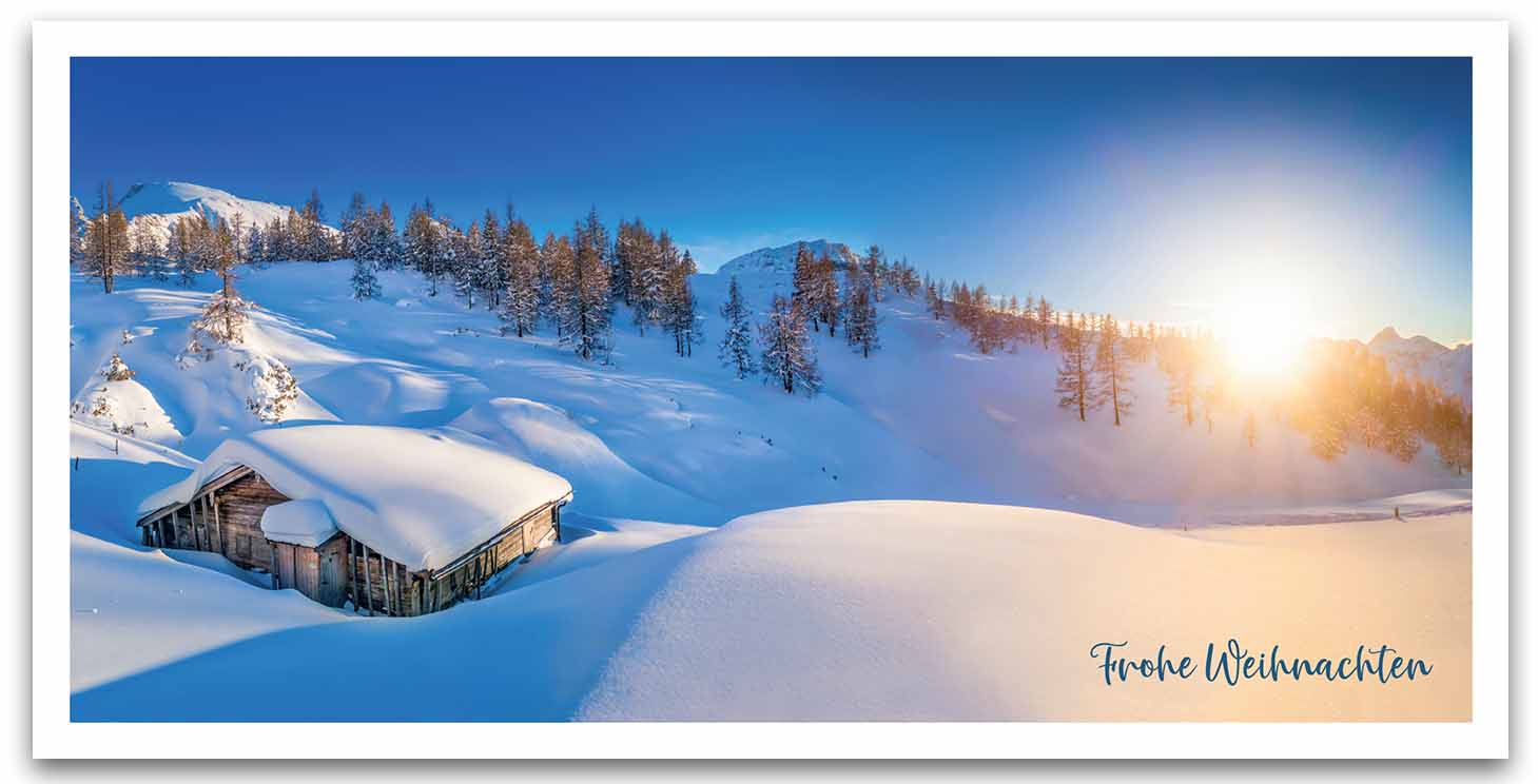 Winterliche Weihnachtskarte mit Gruß und verschneiter Berglandschaft bei Sonnenaufgang