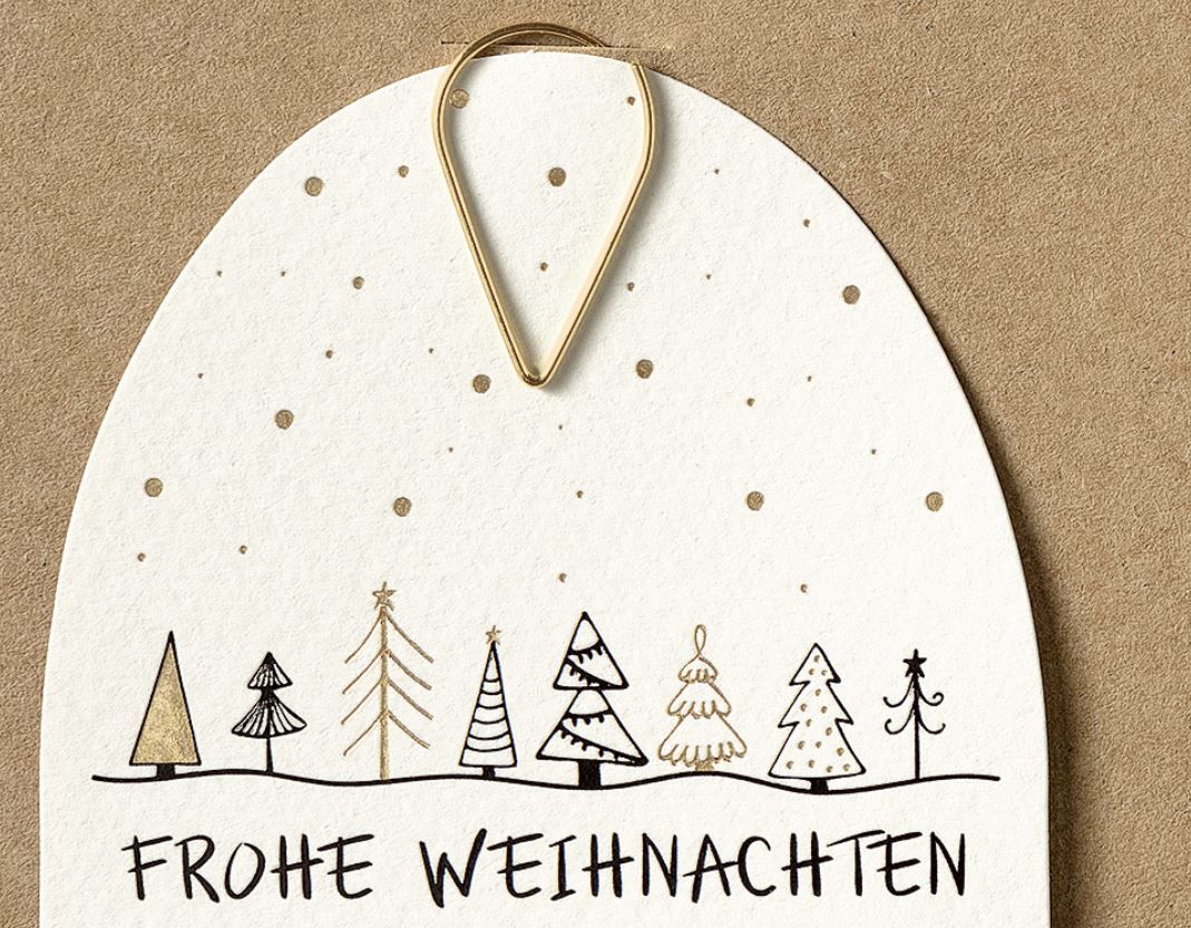 Detaillierte Ansicht der Schneekugel mit Weihnachtsgruß und goldene Klammer