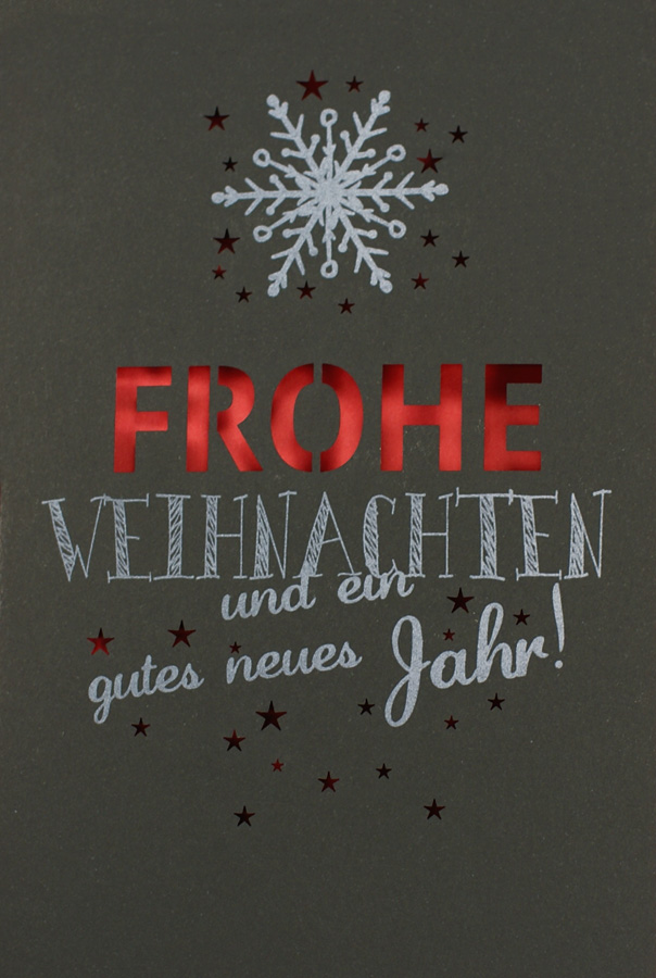 Moderne Weihnachtskarte in schwarz und rot mit Stanzung von Sternen und Wort und rotem Kuvert