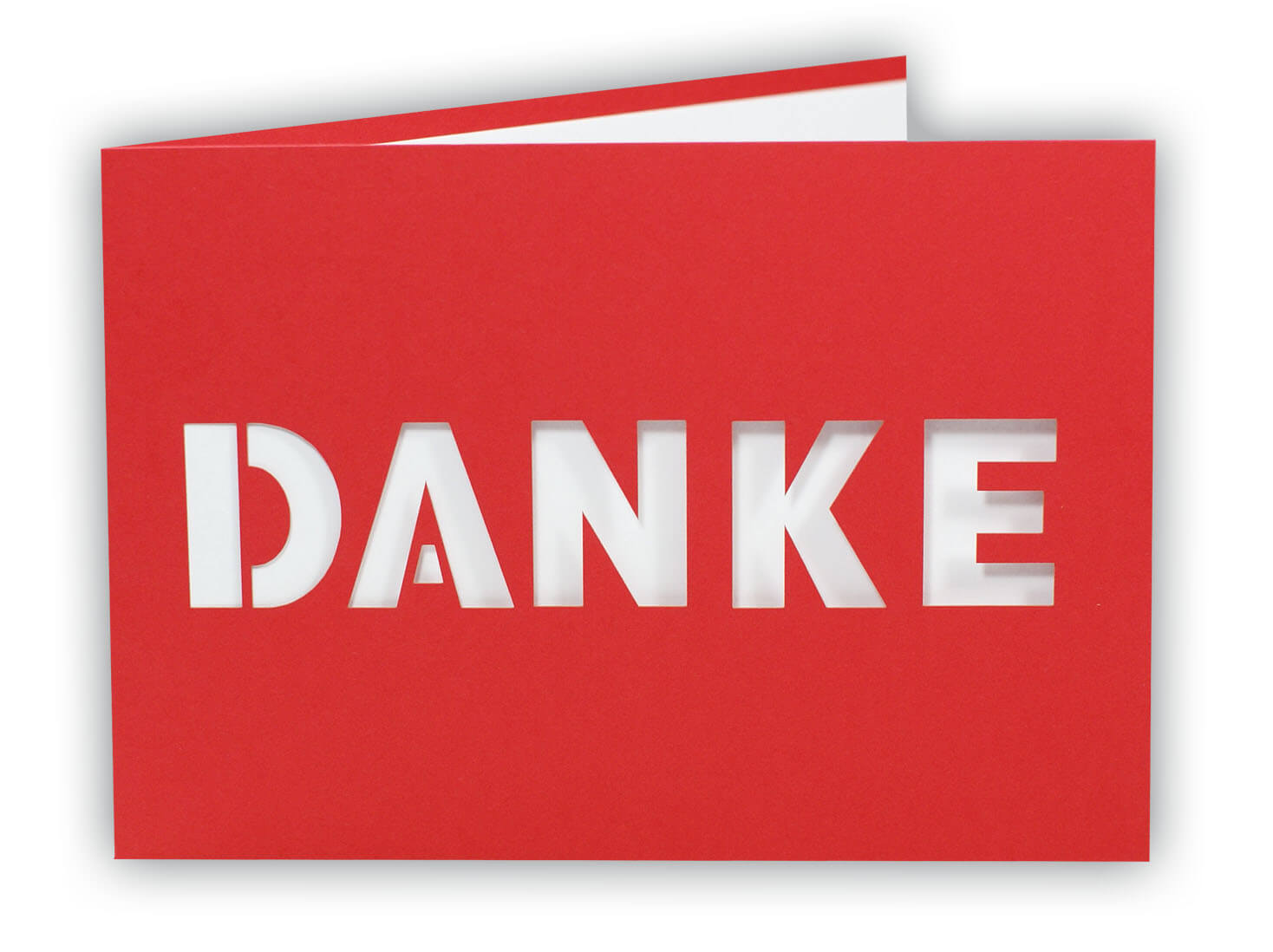 Rote Danksagungskarte mit zentral ausgestanztem Schriftzug "DANKE" und weißem Einlegeblatt