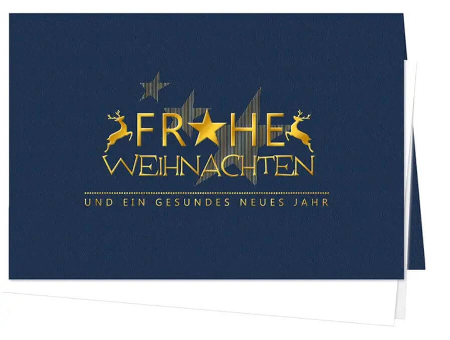 Blaue Weihnachtskarte mit edler Goldfolienprägung von Gruß, Sternen und springenden Hirschen