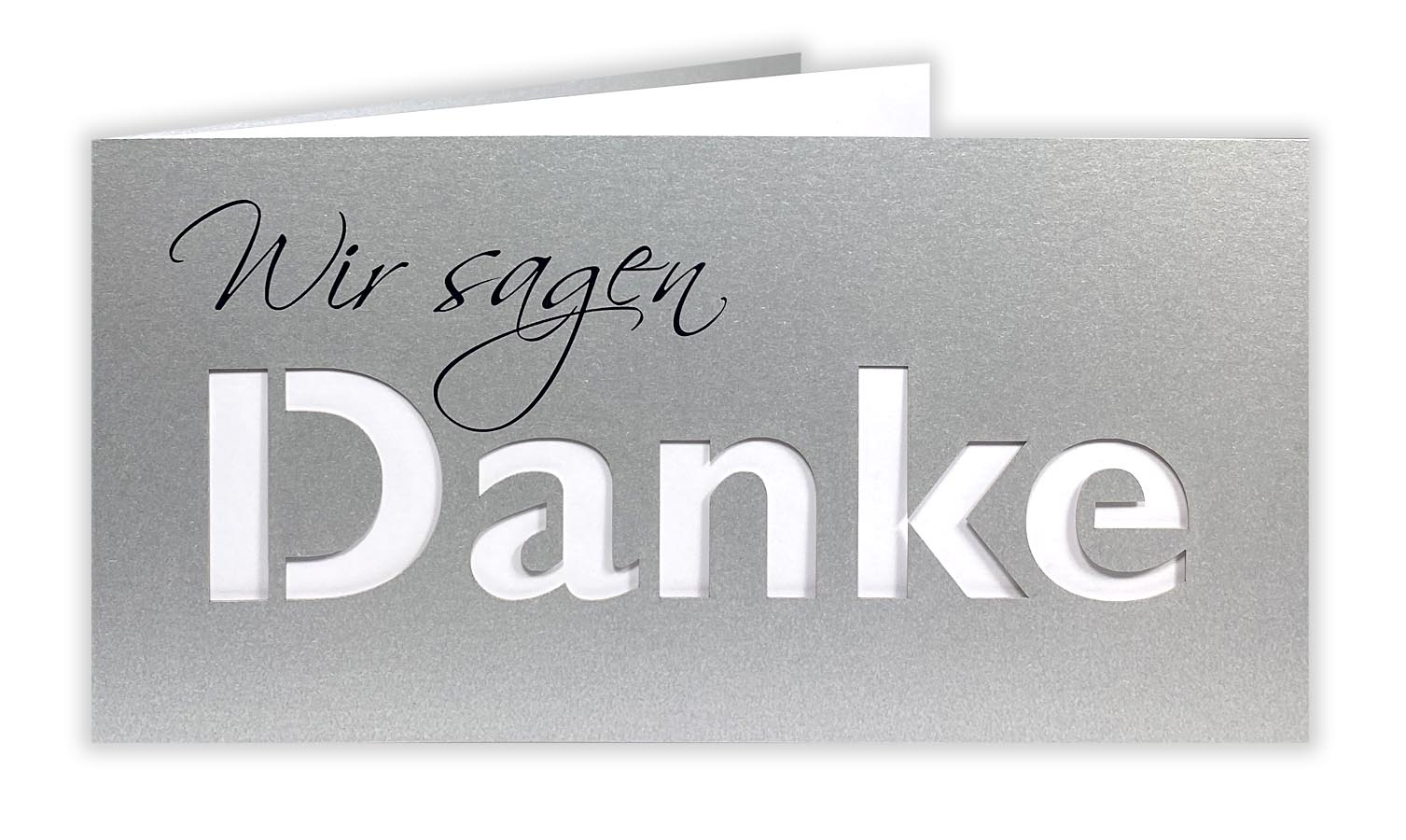 Silberne Dankkarte DIN lang mit gedrucktem "Wir sagen", ausgestanztem Schriftzug "DANKE" und passendem Einlegeblatt