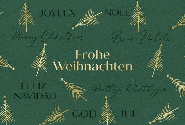 Mehrsprachige Weihnachtskarte in grün mit goldenen Weihnachtsbäumen, Gruß und Blindprägung